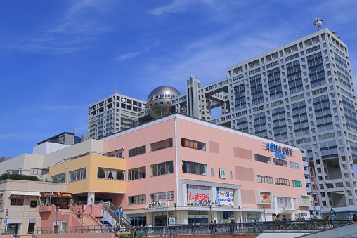 Tokyo Japan - May 22, 2015: People visit Odaiba Aqua city shopping mall and contemporary Fuji Television building in Odaiba Tokyo Japan.