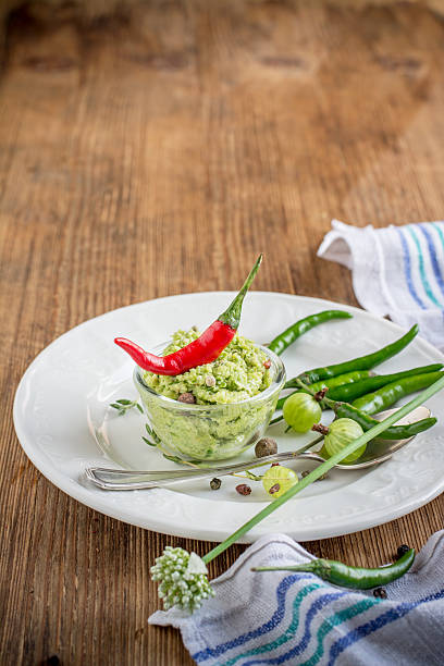 istock Green hot sauce with young garlic in portion bowl 482669184
