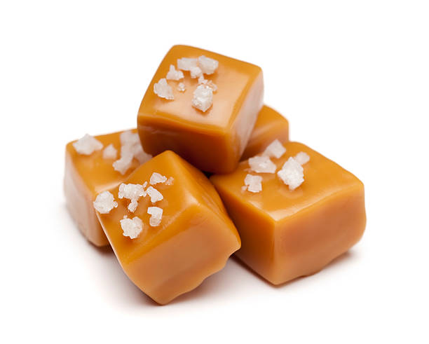 Salted Caramel Salted caramel on white background. Please see my portfolio for other food images. soft object stock pictures, royalty-free photos & images