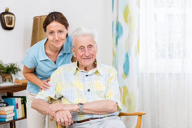 istock Senior Man with caregiver 482671085