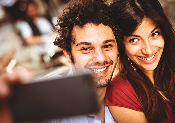 istock happiness couple self photographing 482671195