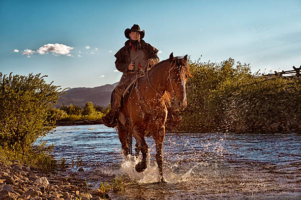 Gunslinger On Horseback Riding In The Riverbed