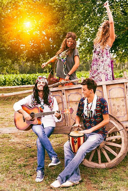 istock Hippie group singing and dancing on a cart 482671497
