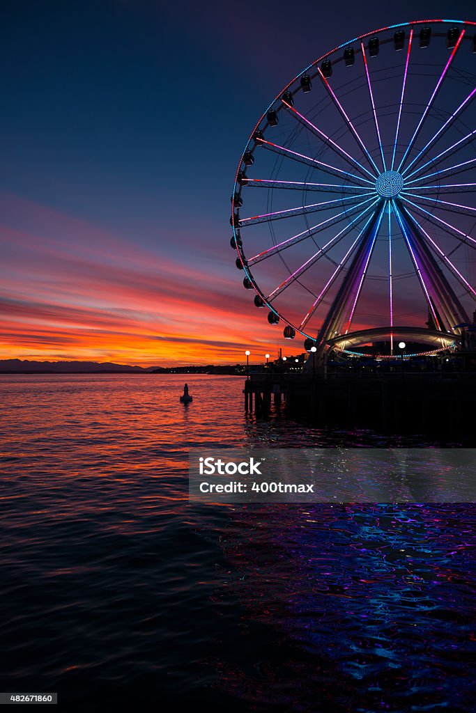 Elliott Bay Sunset A vivid sunset on Elliott bay Seattle Great Wheel Stock Photo