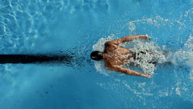 HD Super Slow-Mo: Swimmer Performing The Butterfly Stroke
