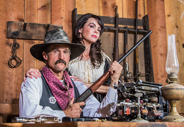 istock Western Sheriff Poses With Woman 482672253