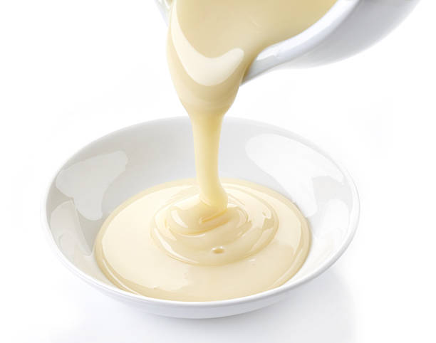 pouring condensed milk with sugar in a bowl