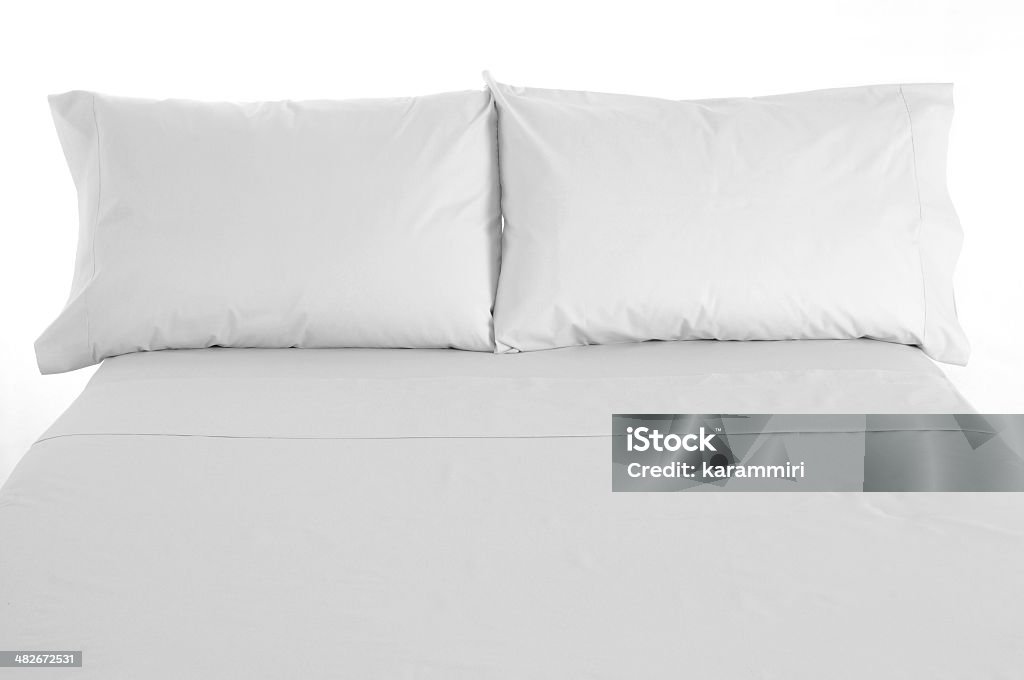 Bedding. Front view of a white bed. Bed - Furniture Stock Photo