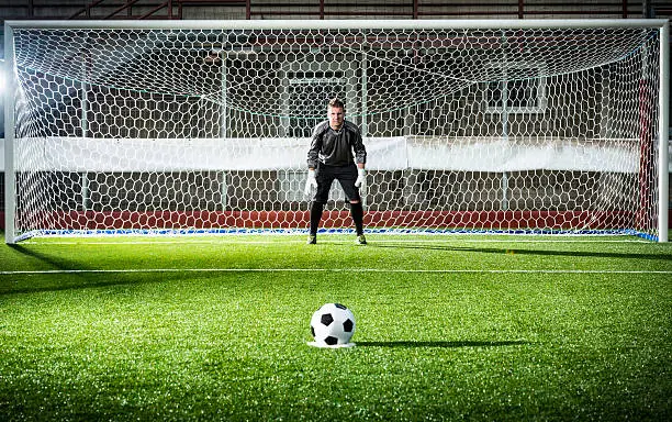 Football match in stadium: Penalty kick