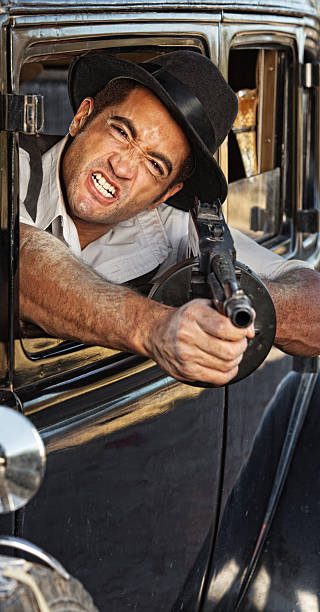istock Angry Gangster Shooting Gun 482674437