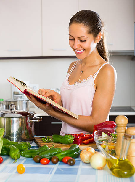 istock Female cooking with veggies at home 482674808