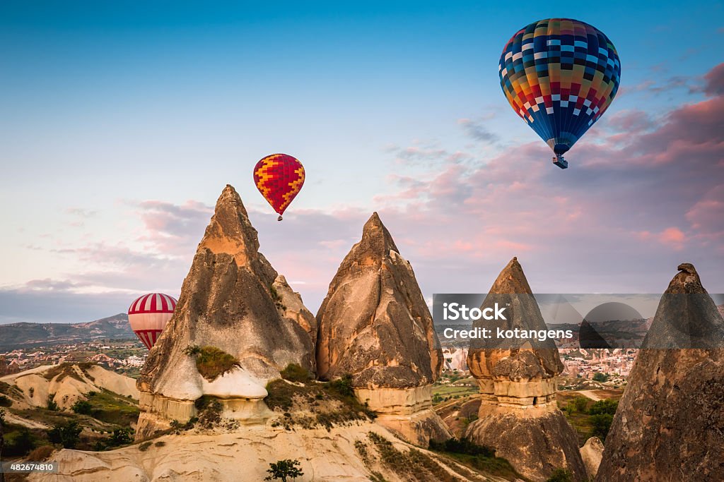 Hot air balloon flying over Cappadocia, Turkey Hot air balloon flying over Cappadocia region, Turkey 2015 Stock Photo