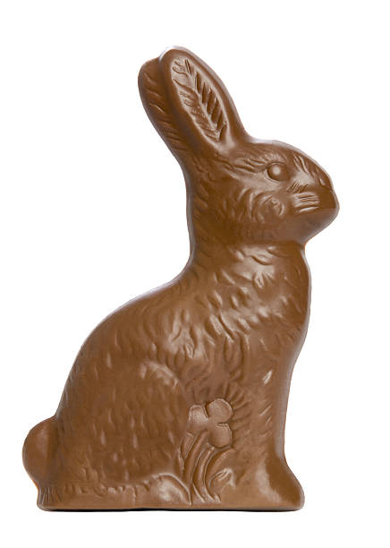Chocolate Easter Rabbit A chocolate Easter rabbit set against a pure white background. chocolate bunny stock pictures, royalty-free photos & images