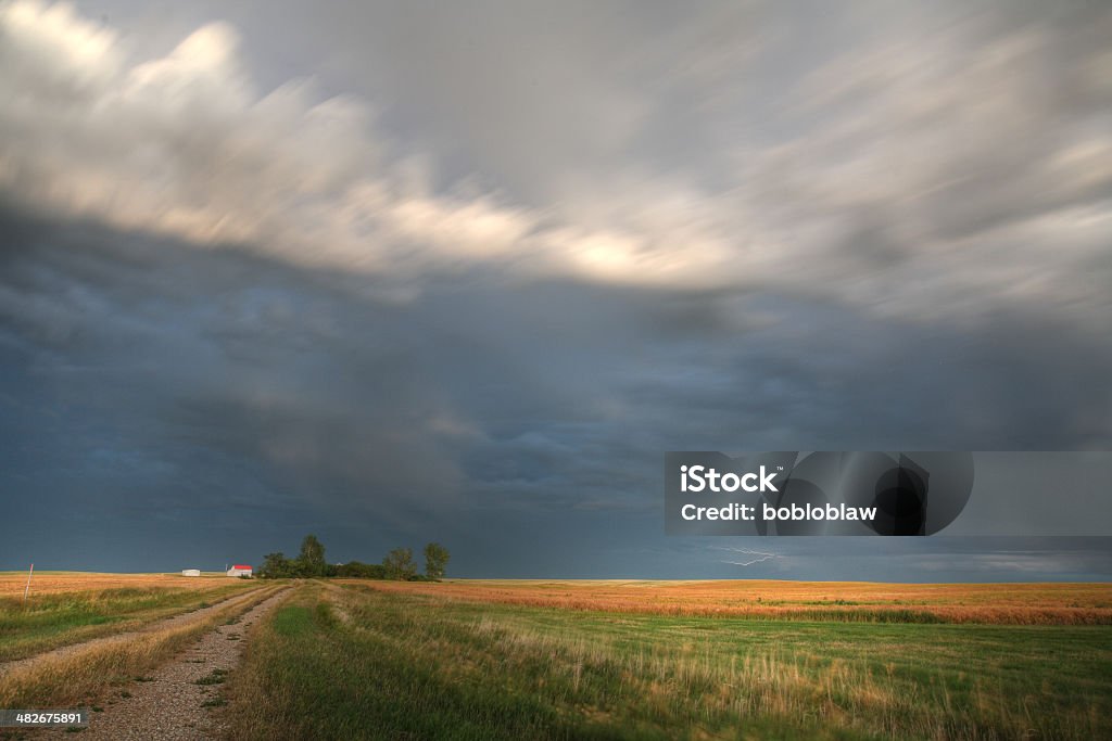 Storm clouds along a Saskatchewan farm road Canada Stock Photo