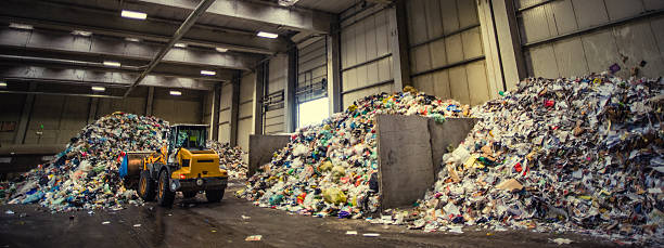 istock Panoramic shot of the excavator in the garbage dump 482676334
