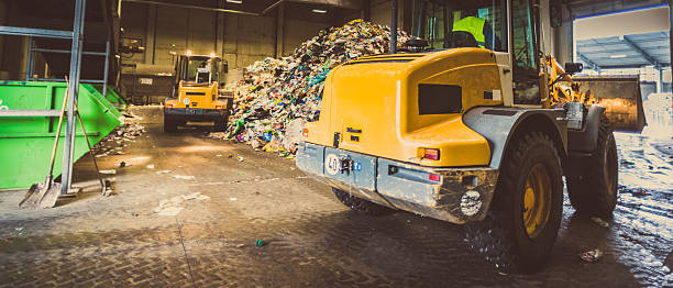 istock Panoramic shot of the excavators in the garbage dump 482676346