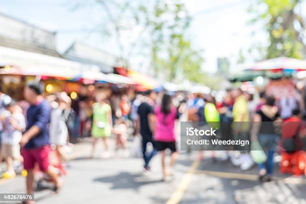 Blurred Background People Shopping At Market Fair In Day Stock Photo - Download Image Now