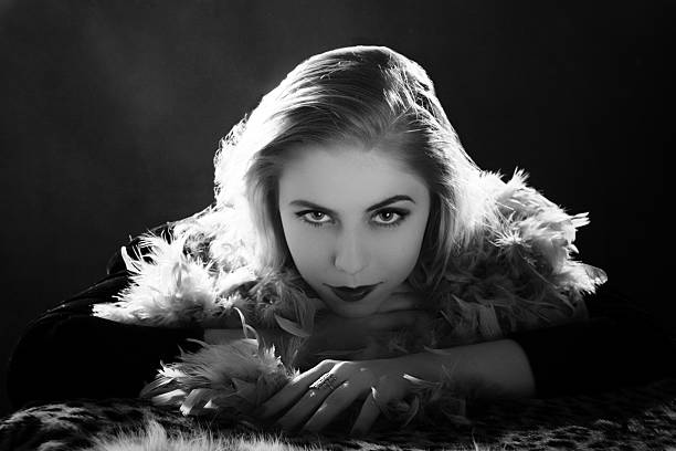 Film Noir style. Female portrait. Emulation of vintage style photography.Grain added for more film effect. femme fatale stock pictures, royalty-free photos & images