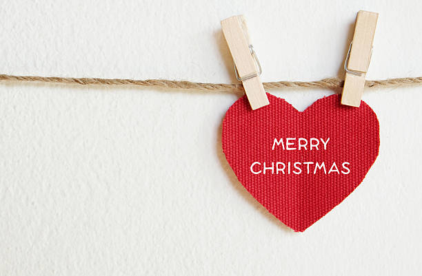 istock Red fabric heart shape with Merry Christmas words. 482685518