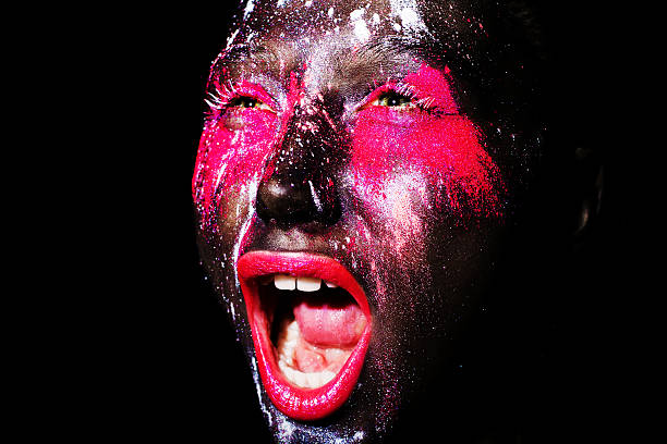 art photo of model with creative black mask colorful makeup.