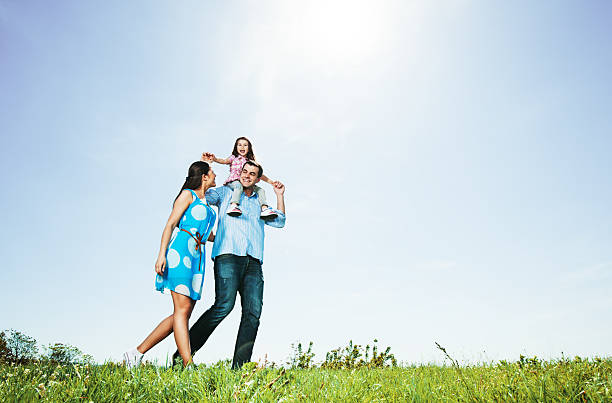 istock Happy family in park taking a walk 482689863