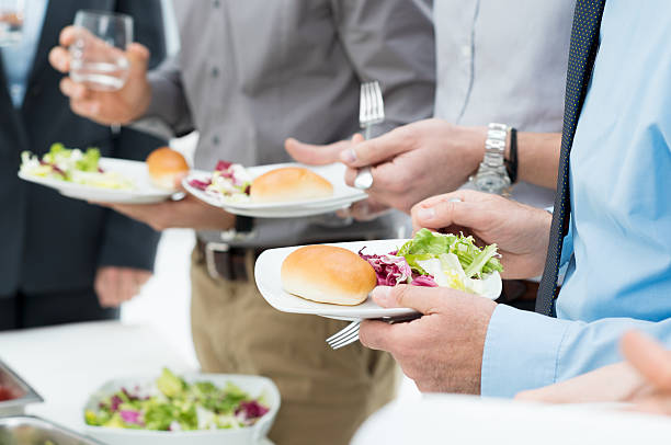 Business Lunch Detail Closeup Of Business People's Hands Having Lunch Together business lunch stock pictures, royalty-free photos & images