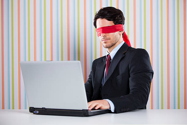 istock Blind businessman working at the office 482694053