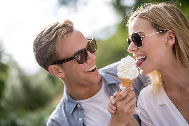 istock Couple eating ice cream at the park 482694212