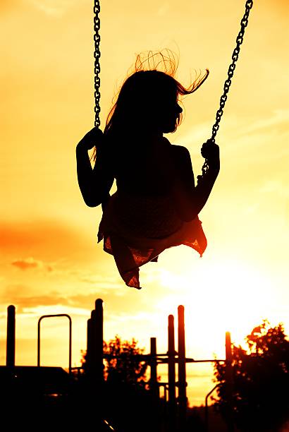 istock Girl Swinging at Park 482695399