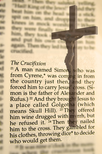 The  passage from the Bible on the Crucifixion with the image of Christ on the the cross.