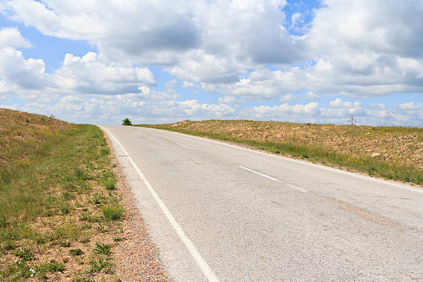 istock The asphalt  road running diagonally over the horizon 482698632