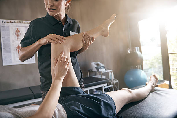 Help for hurting muscles Shot of a physiotherapist treating a patient http://195.154.178.81/DATA/i_collage/pu/shoots/805226.jpg alternative healthcare worker stock pictures, royalty-free photos & images