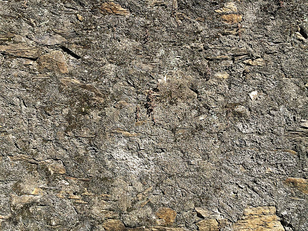 exture wall concrete and stone peeling. stock photo