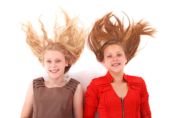 istock Two young girls with scattered long hairs 482705948