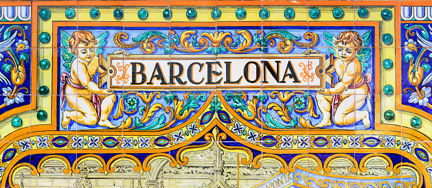 Detail of colourful ceramic Spanish tiles in Seville. Plaza de Espana, Andalusia. 
