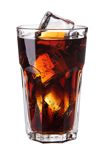 Image of Cola glass with ice cubes over white stock photo