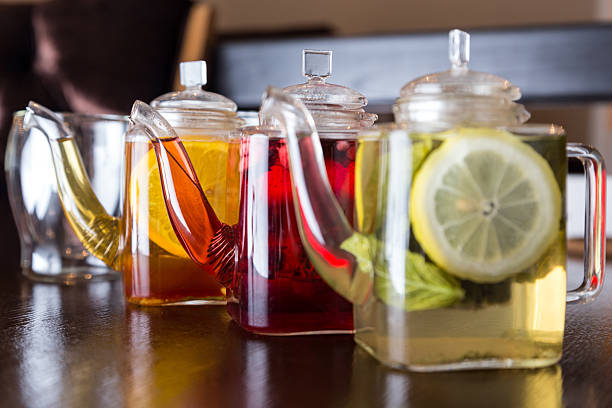 three square teapots with different fruit tastes of tea