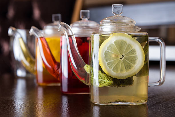 istock three square teapots with different fruit tastes of tea 482708689