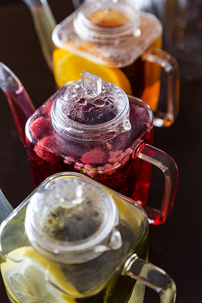 istock three square teapots with different fruit tastes of tea 482708711