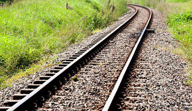 istock Shiny Curved Railway Track Running Through Countryside 482709787