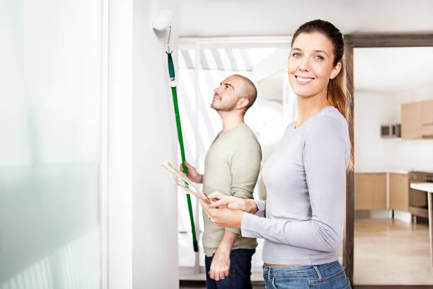 istock Couple painting the wall 482709915