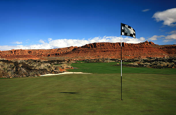 Desert Golf A flag on a desert golf green. snow canyon state park stock pictures, royalty-free photos & images