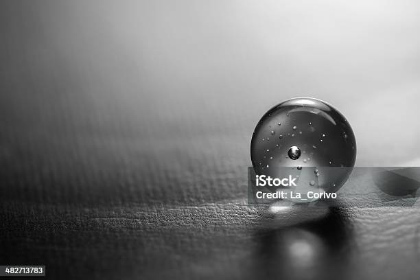 Black White Artistic Composition Of Clear Glass Ball Stock Photo - Download Image Now