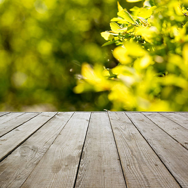 istock Wooden perspective floor with planks on blurred background 482714644