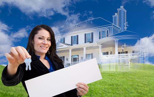 Hispanic Woman Holding Keys and Blank Sign with Ghosted House Drawing, Partial Photo and Rolling Green Hills Behind.