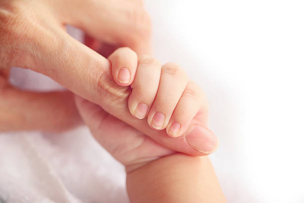 istock Newborn baby holding mother's hand, image with shallow depth of 482719840