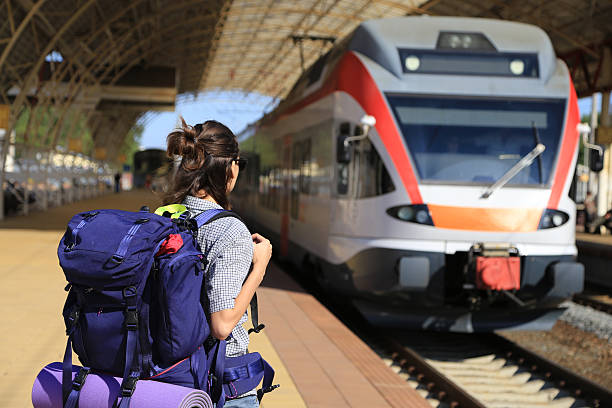 istock backpackers girl waiting for the train 482720044