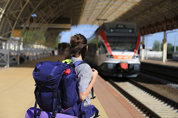 istock backpackers girl waiting for the train 482720046