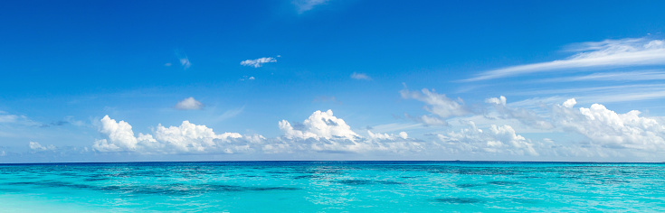Caribbean panorama Hawaiian Maldivian Bahamian coast with a boat in a turquoise tropical sea