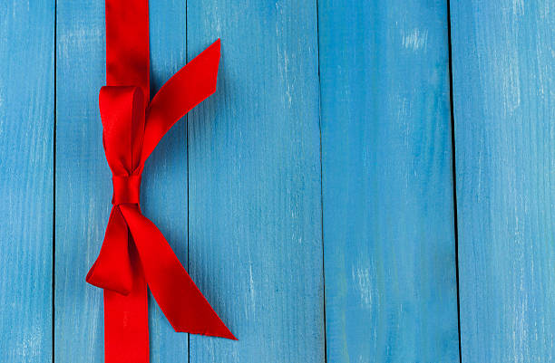 istock Top view of red ribbon with bow 482721050